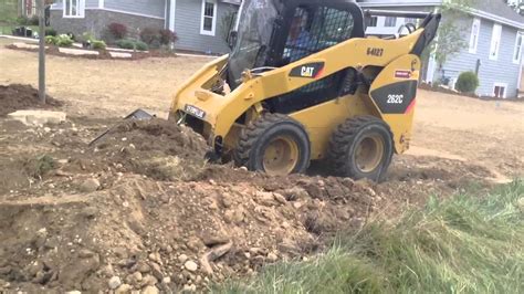 skid steer pushing dirt|how to use a skid steer.